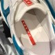 Close-up of internal footbed with red Prada logo inside blue and white trainer