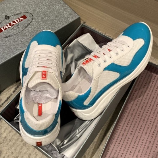 Overhead view of Prada America's Cup blue and white trainers inside their shoe box