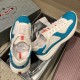 Overhead view of Prada America's Cup blue and white trainers inside their shoe box