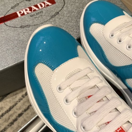 Detailed close-up of blue patent toe cap and white lace structure on trainer