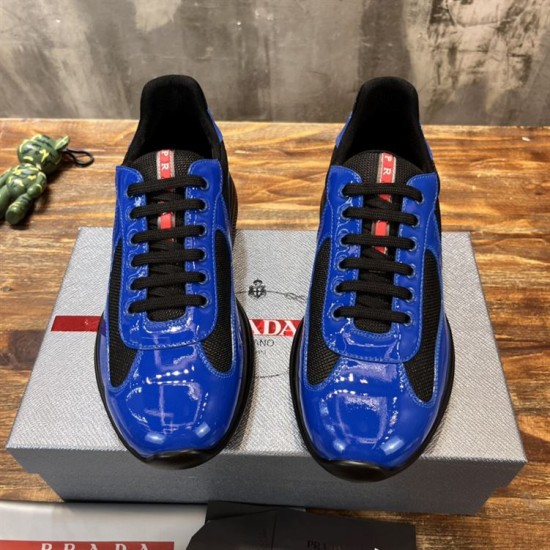 Prada America's Cup Trainers Front View in blue and black Front view of pair of Prada blue and black patent trainers on shoe box