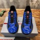 Prada America's Cup Trainers Front View in blue and black Front view of pair of Prada blue and black patent trainers on shoe box