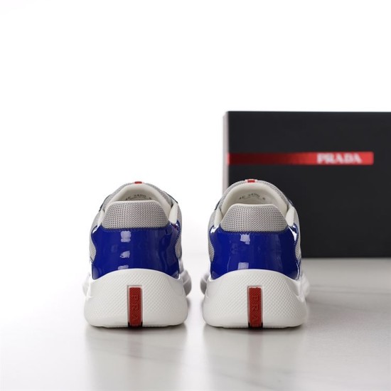 Prada America's Cup Trainer Heel Logo Detail in blue and grey Back view showing red logo branding on the heels of Prada blue trainers in blue and grey