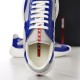 Prada America's Cup Trainer Laces and Tongue Detail in blue and grey Close-up front view of the lacing system and red logo tongue on Prada trainer in blue and grey