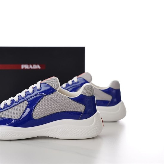 Prada America's Cup Trainers Heel Perspective in blue and grey Rear dynamic view showing the heels of Prada blue patent and grey mesh trainers