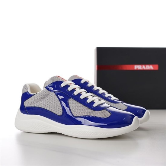 Prada America's Cup Trainers Pair View in blue and grey Pair of Prada blue and grey patent mesh trainers presented at a three-quarter angle