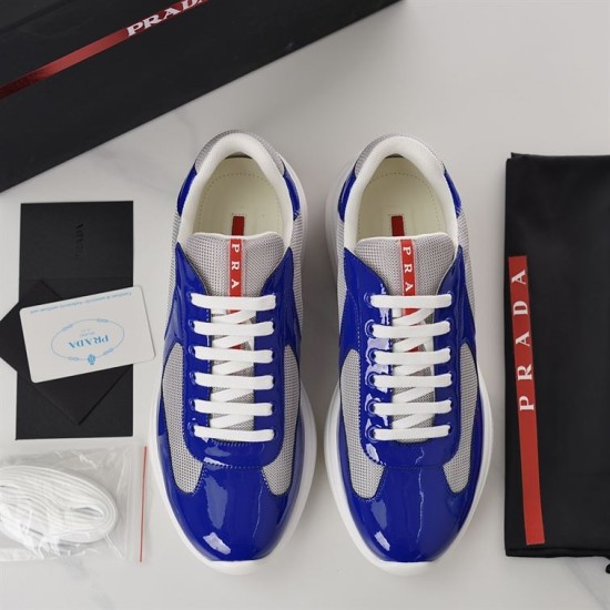 Prada America's Cup Trainers Top View in blue and grey Top-down overhead shot of Prada blue and grey trainers with laces and packaging