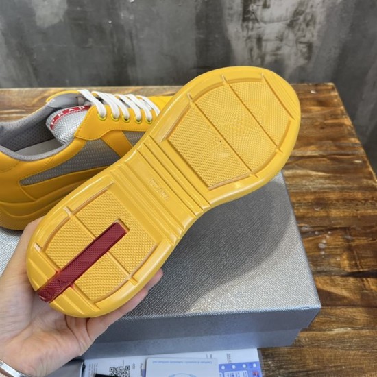 Underside yellow rubber sole with signature red Prada tread detail in yellow and grey