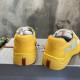 Rear view showing heel counters with iconic red Prada logo strips in yellow and grey