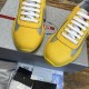 Front toe cap and lace section detail on Prada yellow trainers in yellow and grey
