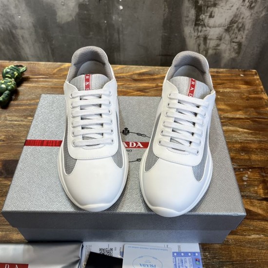 Front view of white and grey Prada America's Cup trainers