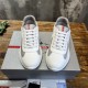 Front view of white and grey Prada America's Cup trainers