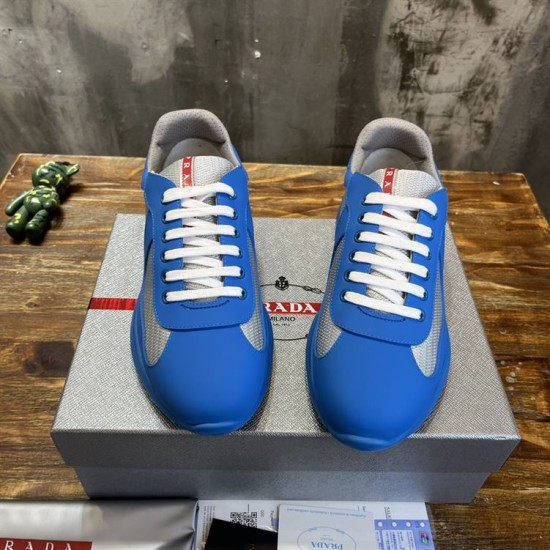 Prada America's Cup Blue Trainers Front Profile in blue and grey Top-front view showing the white laces and red logo tongue of blue Prada trainers in blue and grey