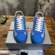 Prada America's Cup Blue Trainers Front Profile in blue and grey Top-front view showing the white laces and red logo tongue of blue Prada trainers in blue and grey