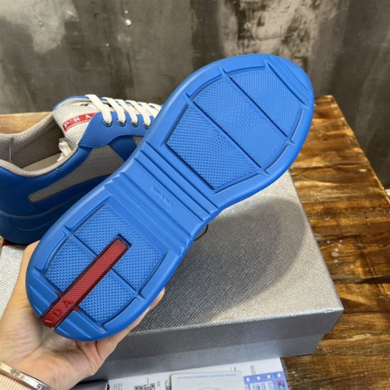 Prada America's Cup Blue Trainer Outsole in blue and grey Underside view of the blue rubber tread sole with red branded inset on Prada trainer in blue and grey