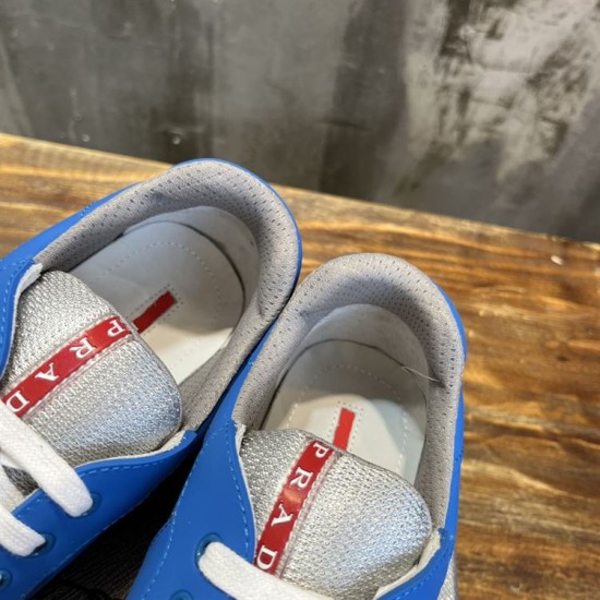 Prada America's Cup Blue Trainers Collar and Tongue Detail in blue and grey Close-up of internal lining and red logo tag on the tongue of Prada blue trainers in blue and grey
