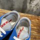 Prada America's Cup Blue Trainers Collar and Tongue Detail in blue and grey Close-up of internal lining and red logo tag on the tongue of Prada blue trainers in blue and grey