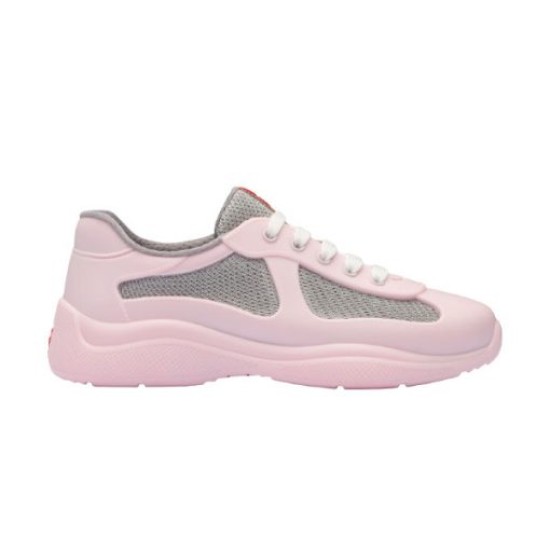 Studio lateral profile of pink and grey rubber trainer on white backdrop