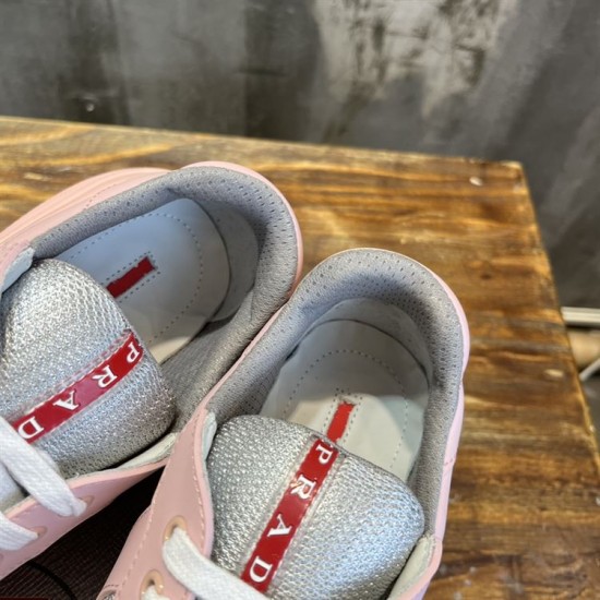 Close-up view of padded inner lining and red logo tongue tags in pink and grey