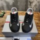 Front Pair View Prada Trainers in black and grey Front view pair of Prada black rubber and grey mesh lace-up trainers