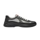 Side View Prada America's Cup Trainer in black and grey Side profile of Prada America's Cup soft rubber and bike fabric trainer in black and grey studio shot