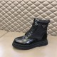 Prada Leather and Nylon Combat Boot Side View in black and white Lateral view of a Prada black boot highlighting the combination of nylon upper and glossy leather base in black and white