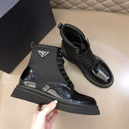 Prada Black Boot Outer Profile Detail in black and white Hand holding a Prada brushed leather and nylon boot in black showing outer side detail in black and white