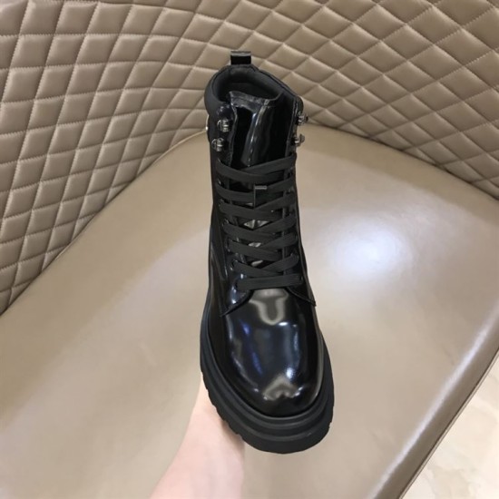 Prada Brushed Leather Boot Front Angle in black and white Front perspective of a black Prada boot displaying polished toe cap and lacing in black and white