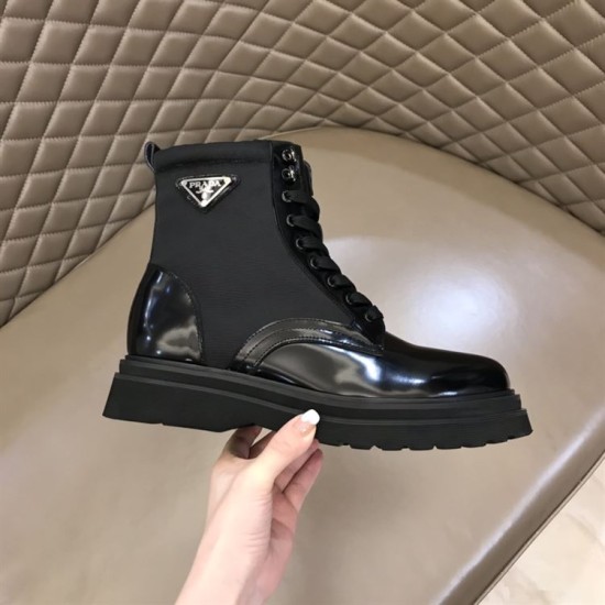 Prada Black Nylon Boot Logo View in black and white Side profile view of black Prada brushed leather and nylon boot showing triangle logo plaque in black and white