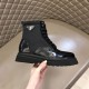 Prada Black Nylon Boot Logo View in black and white Side profile view of black Prada brushed leather and nylon boot showing triangle logo plaque in black and white