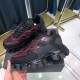Prada Cloudbust Thunder Trainers on Box in black and red Prada Cloudbust Thunder trainers displayed on shoe box showing lateral overlay design in black and red