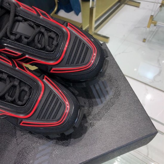 Prada Cloudbust Thunder Toe Box Detail in black and red Detailed view of red linear rubber accents on the toe box of Prada trainers in black and red