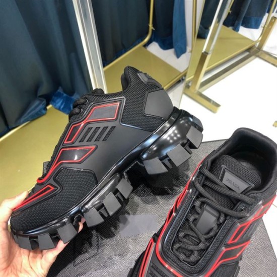 Prada Cloudbust Thunder Trainer Profile Detail in black and red Side elevation of black Prada trainer showing thick sculpted tread sole and red accents