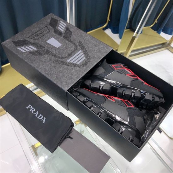 Prada Cloudbust Thunder Packaging View in black and red Prada Cloudbust Thunder trainers packaged inside original shoebox with dust bag in black and red