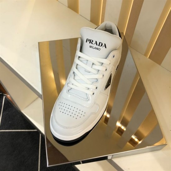 Prada Downtown Trainer Front Angle in white and black Front upper perspective of Prada Downtown white trainer on a reflective stand in white and black