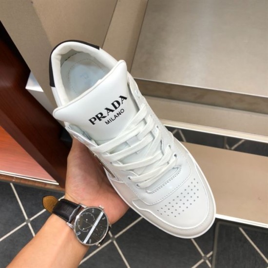 Prada Downtown Trainer Tongue Detail in white and black Top-down view of Prada Downtown trainer tongue with printed brand lettering in white and black