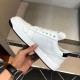 Prada Downtown Trainer Medial Profile in white and black Medial side view of Prada Downtown white leather trainer showing sleek stitched panels in white and black