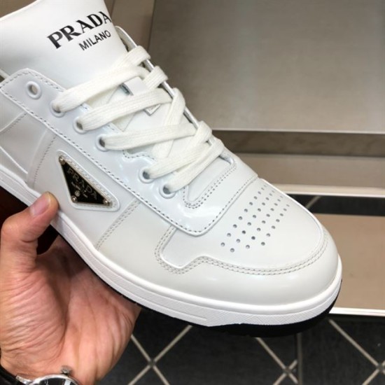 Prada Downtown Trainer Toe Box and Logo Close-Up in white and black Close-up of Prada Downtown white trainer toe box and enamelled triangle logo in white and black