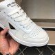 Prada Downtown Trainer Toe Box and Logo Close-Up in white and black Close-up of Prada Downtown white trainer toe box and enamelled triangle logo in white and black