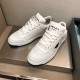 Pair of Prada Downtown White Leather Trainers in white and black Pair of Prada Downtown white leather trainers set on a display surface in white and black