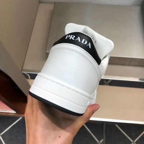 Prada Downtown Trainer Heel View in white and black Rear heel view of Prada Downtown trainer showing black heel tab and white logo text