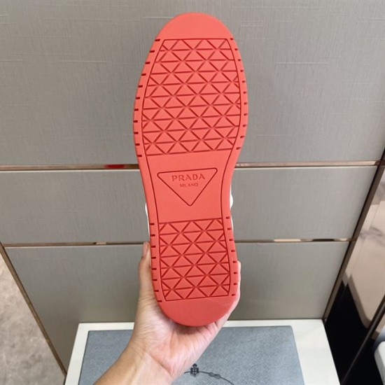 Rubber Outsole Tread of Prada Downtown Trainer in orange and white Bottom outsole view of Prada Downtown trainer in orange with tread design and logo in orange and white