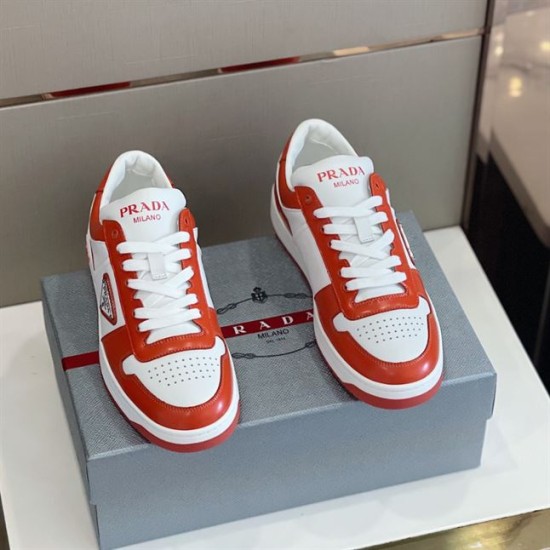 Front View of Prada Downtown Leather Trainers in orange and white Front facing view of orange and white Prada Downtown leather trainers showing toe box and laces