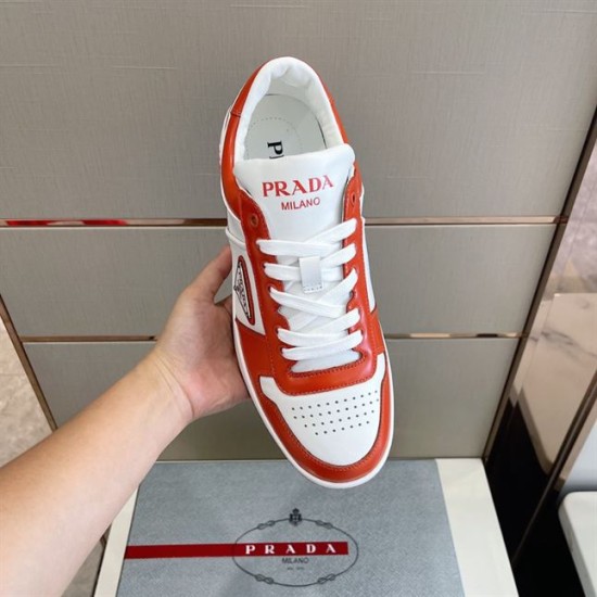 Overhead View of Prada Downtown Leather Trainer in orange and white Overhead handheld view of Prada Downtown orange and white trainer showing lace structure