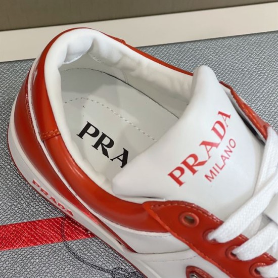 Collar and Tongue Detail of Prada Downtown Trainer in orange and white Close-up detail of padded collar, tongue and branded insole of orange Prada trainer in orange and white