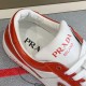 Collar and Tongue Detail of Prada Downtown Trainer in orange and white Close-up detail of padded collar, tongue and branded insole of orange Prada trainer in orange and white
