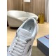 Prada Trainer Tongue Logo Detail in white and navy Close-up of the tongue embossed branding and soft collar of the Prada trainer in white and navy