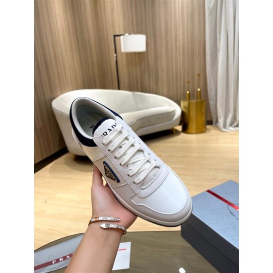 Prada White And Navy Trainer Front Perspective Hand holding a single Prada white and navy trainer showing the toe box and lacing detail