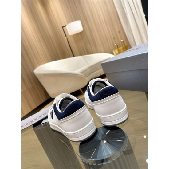 Prada White Trainers Rear Heel View in white and navy Rear angle view of the pair of Prada white trainers displaying navy padded heels