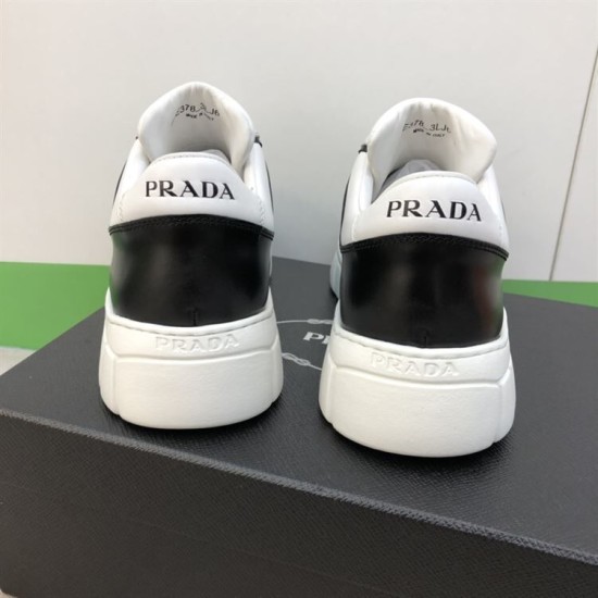 Prada Leather Low Top Trainers In Black And White - Heel Detail Rear view showing heel counters with Prada branding on black and white trainers